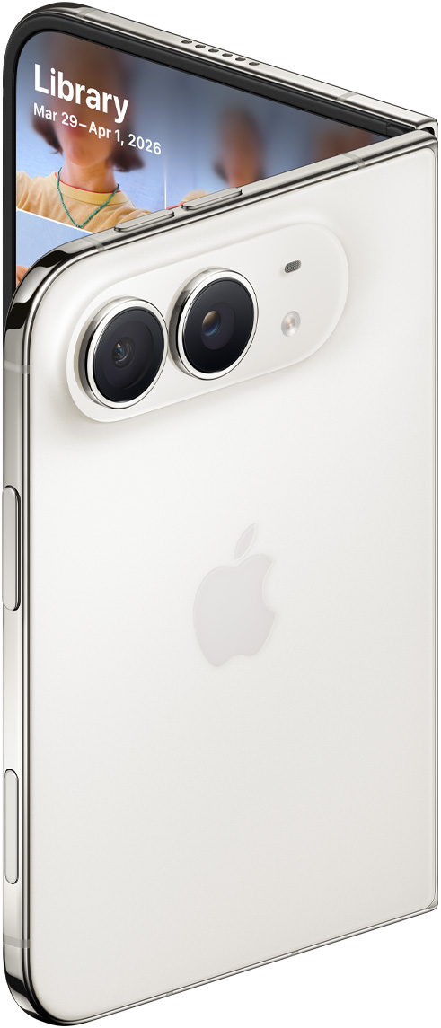 Close-up of the two rear camera lenses on a partially open, silver-colored iPhone Duo.